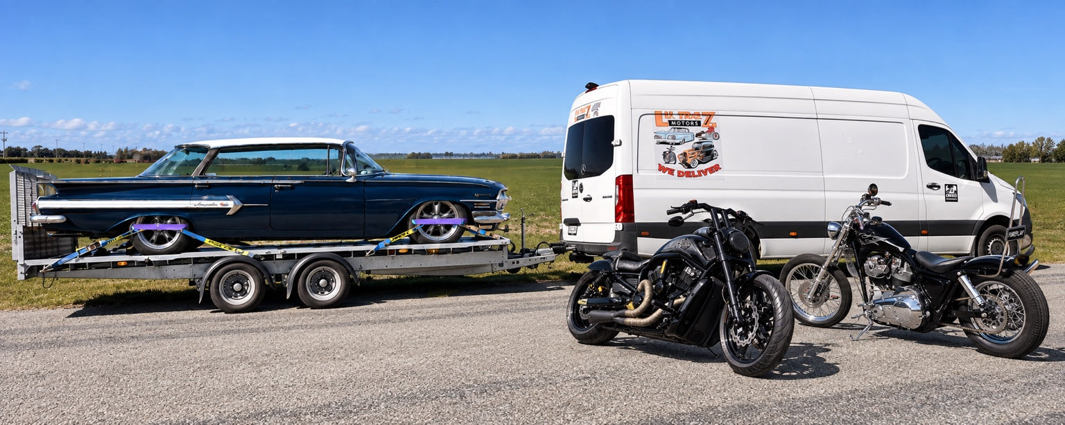 LKTRAZ Motors transporter carrying a blue Chevrolet Impala with two motorcycles beside the van